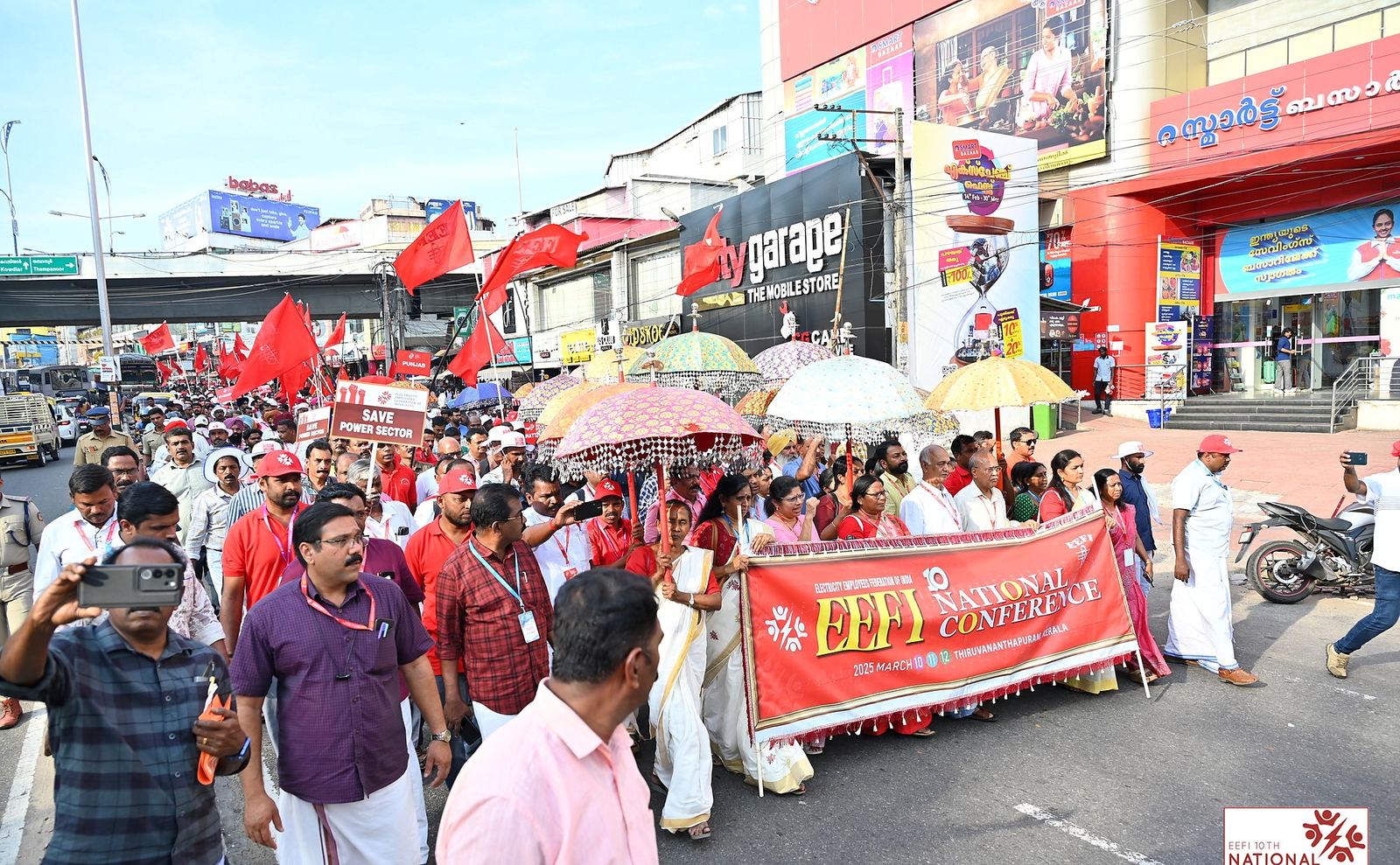 Delegates marching with the EEFI 10th National Conference banner through Thiruvananthapuram