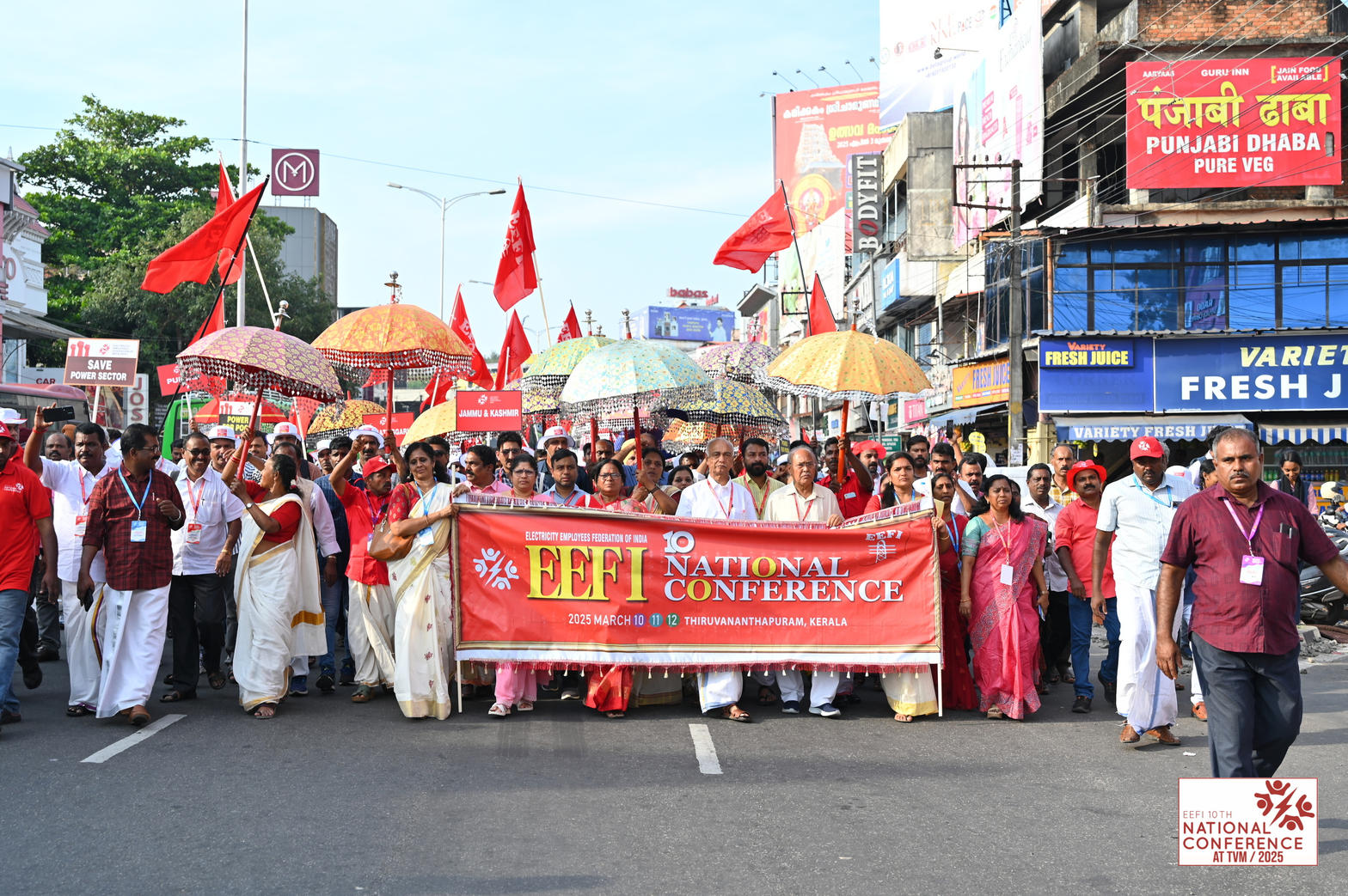 Delegates with the EEFI 10th National Conference banner and red flags