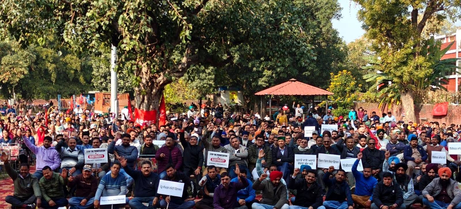 Electricity employees assembled against privatisation of electricity, with placards reading Stop the privatisation of electricity